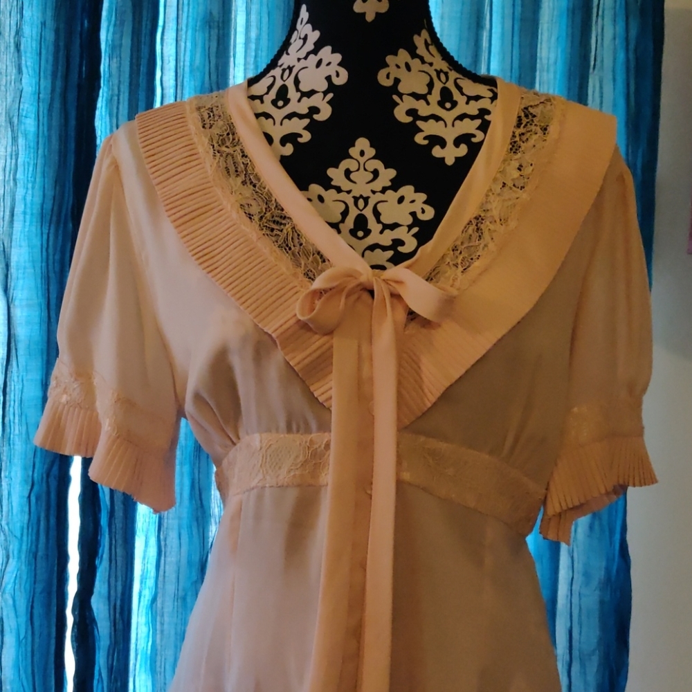 Beautiful feminine peach blouse